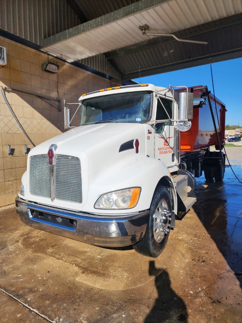 austin dumpsters truck being washed